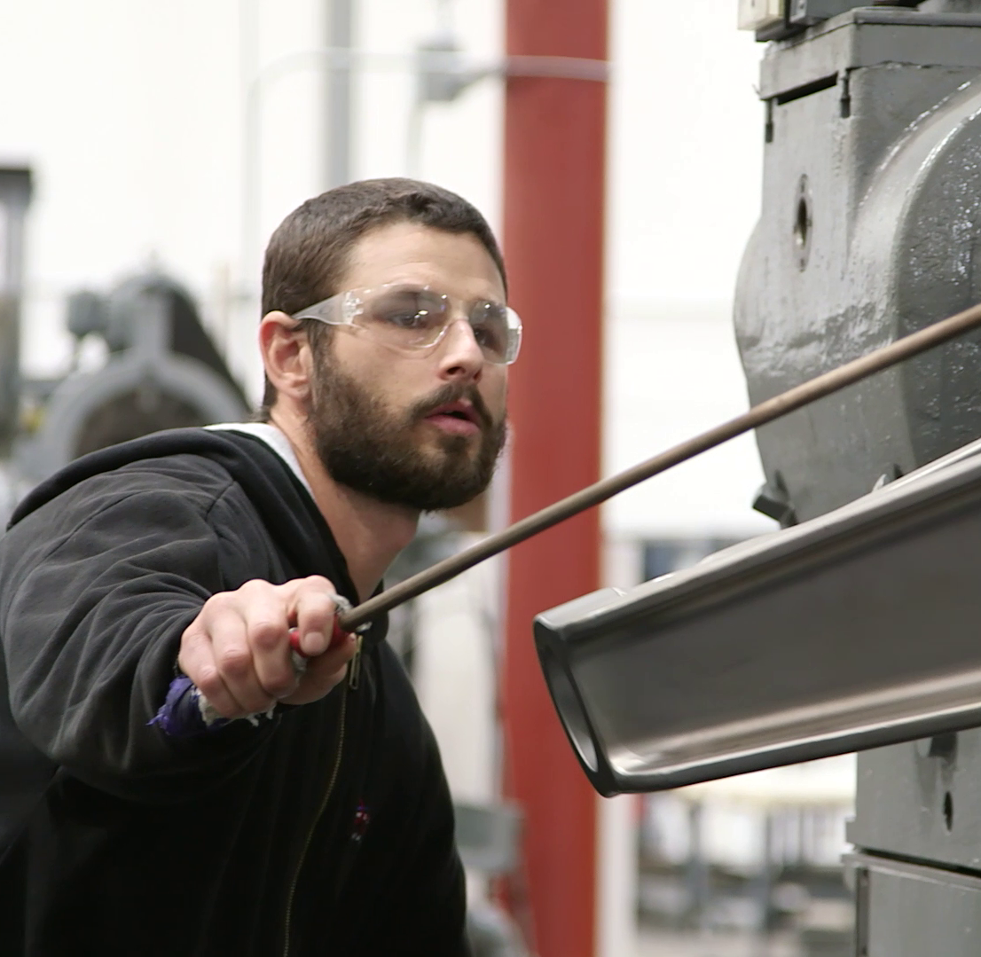 Sunvair shop technician overhauling landing gear